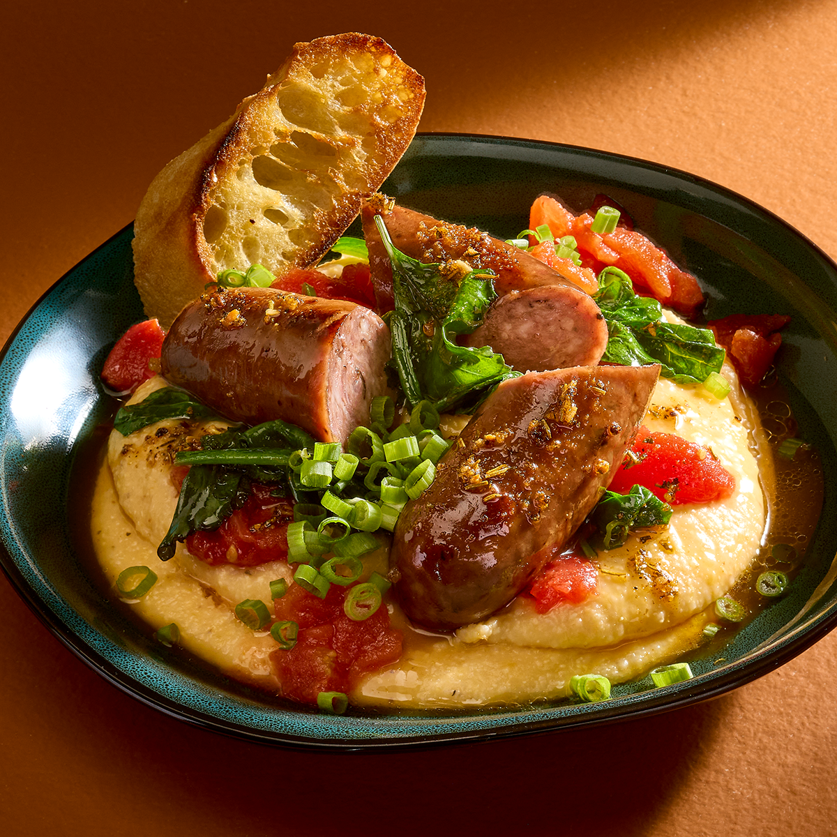 Black Forest Sausage with Cheddar Grits & Collards 